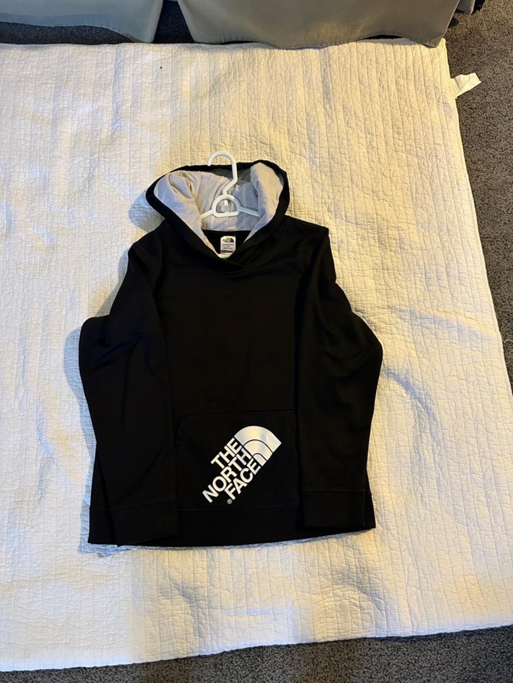 The North Face Black Hoodie with white  Hood Lining